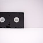 black-and-white-vhs-tape-on-white-wooden-surface-1302308 (2)